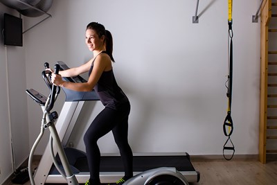 A woman exercises at home